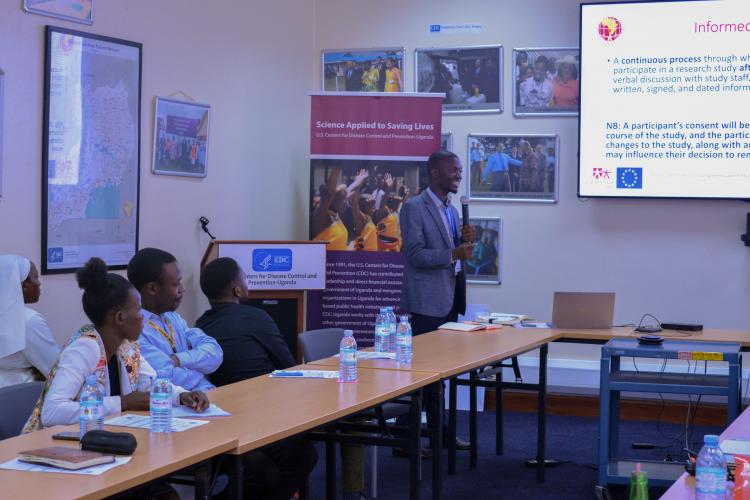 Dr. Benjamin Watyaba presenting to the participants on Informed Consent.